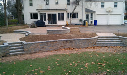 Retaining walls with patio and planting areas