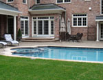 elegant living with a patio walk-out to pool with inset spa
